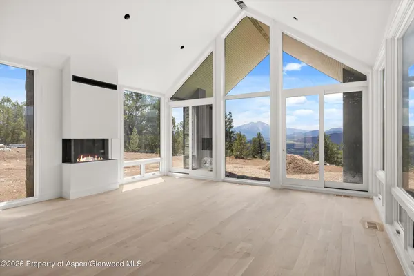 a view of an empty room with windows