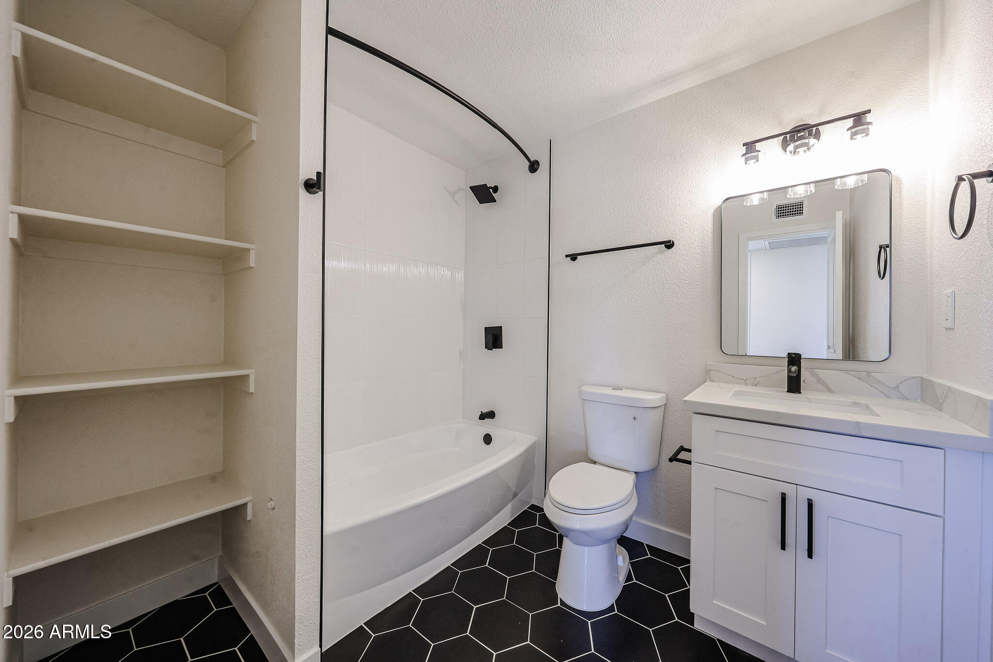 3337 West Ocotillo Road Phoenix, AZ 85017 - Photo 6 of 30 a bathroom with a sink toilet vanity and shower