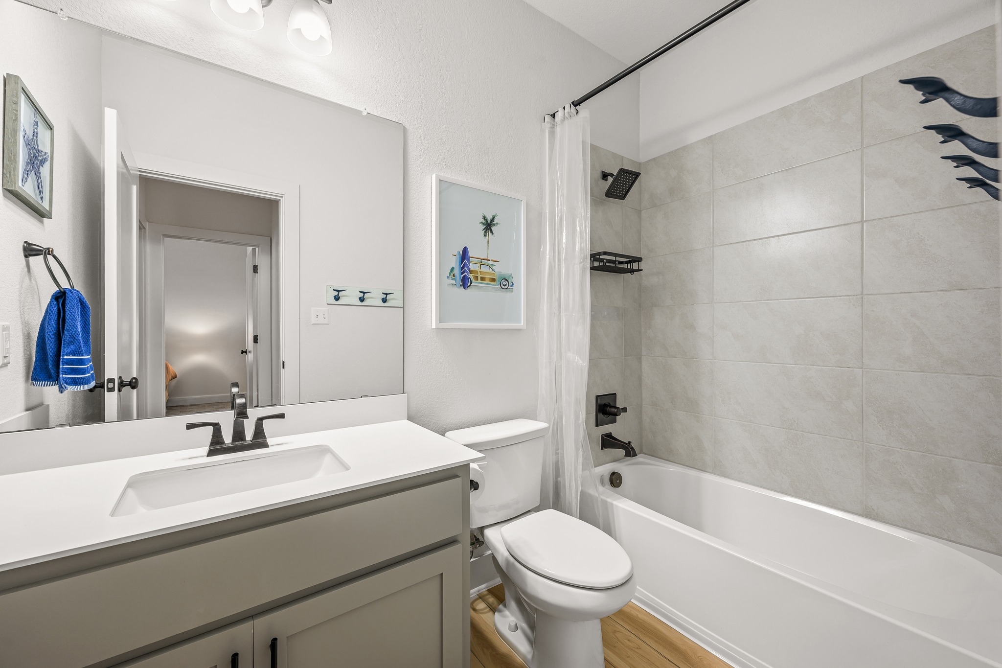 68 Rancho Trail Georgetown, TX 78628 - Photo 23 of 39 A well-appointed bathroom features a sleek vanity, modern fixtures, and a clean-lined bathtub with tiled surround.