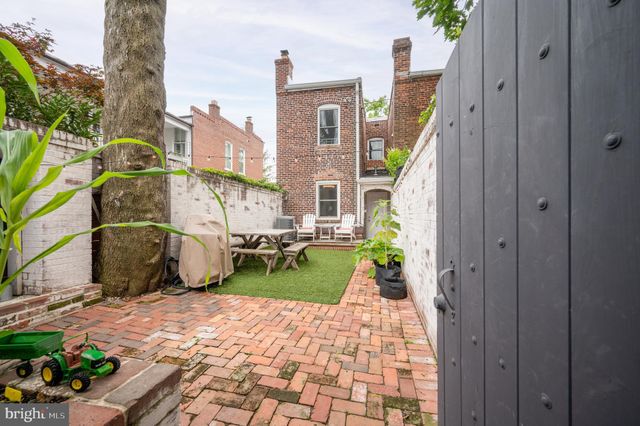 a view of a front door and outdoor seating