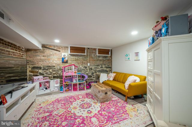 a bedroom with a bed and a couch