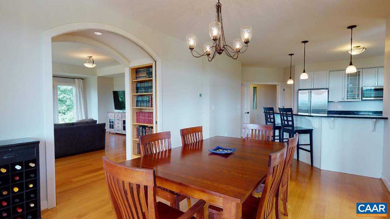 1812 Frays Mill Road Ruckersville, VA 22968 - Photo 17 of 74 a view of a dining room with furniture and wooden floor