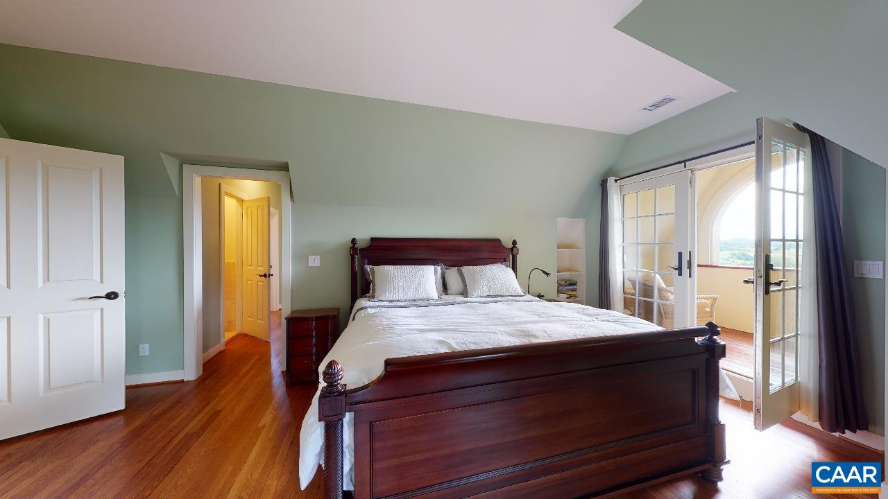 1812 Frays Mill Road Ruckersville, VA 22968 - Photo 21 of 74 a bedroom with a bed and wooden floor