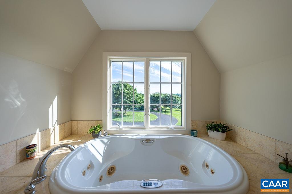 1812 Frays Mill Road Ruckersville, VA 22968 - Photo 29 of 74 a bath tub sitting in a bathroom next to a window