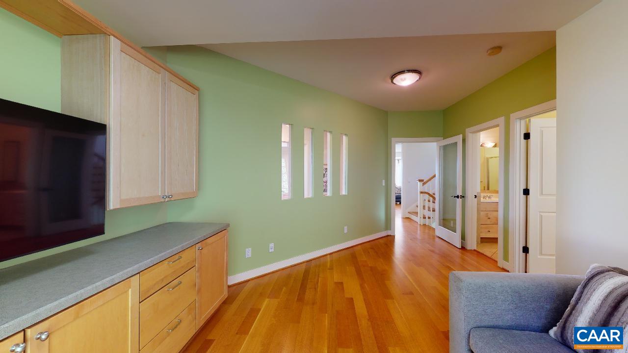 1812 Frays Mill Road Ruckersville, VA 22968 - Photo 36 of 74 a living room with a bed furniture and a flat screen tv