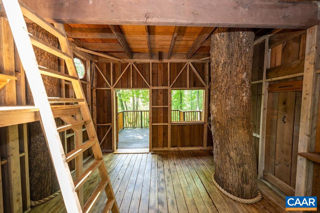 1812 Frays Mill Road Ruckersville, VA 22968 - Photo 56 of 74 a view of an empty room with wooden floor and a window
