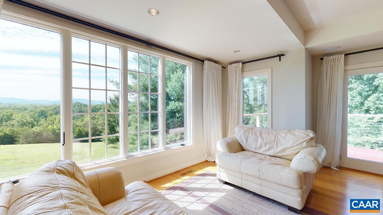 1812 Frays Mill Road Ruckersville, VA 22968 - Photo 10 of 74 a living room with furniture and a large window