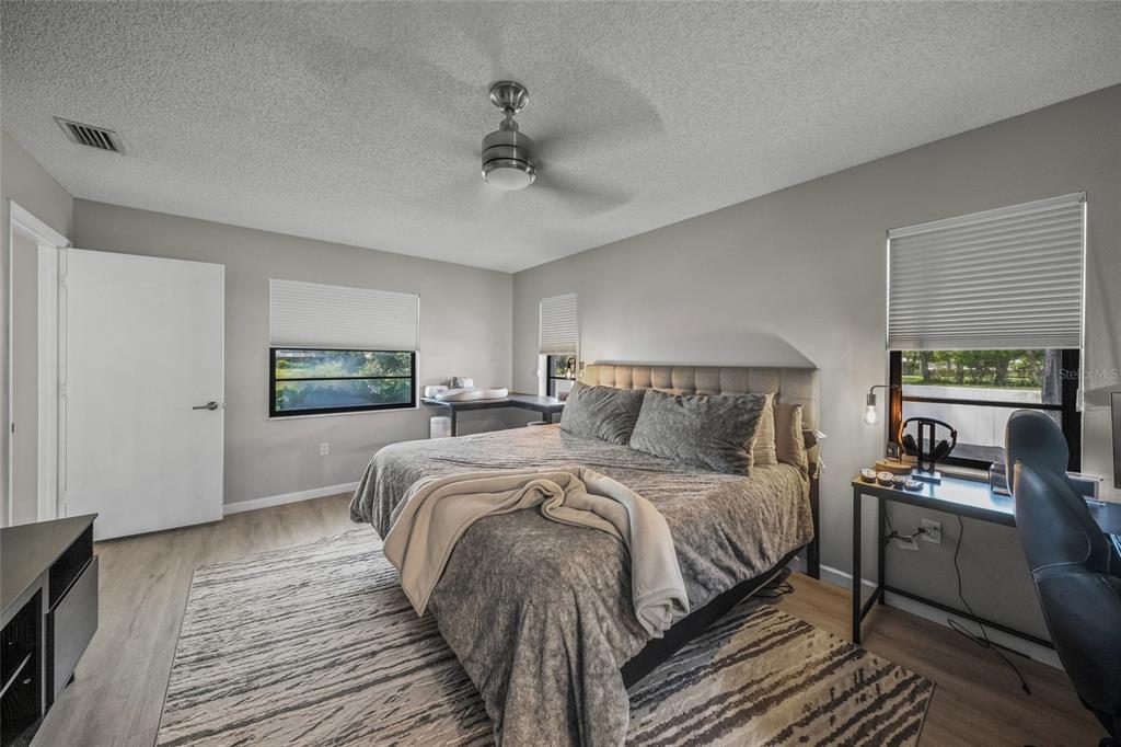 3020 Gypsy Street Sarasota, FL 34231 - Photo 20 of 34 a bedroom with a bed and a tv