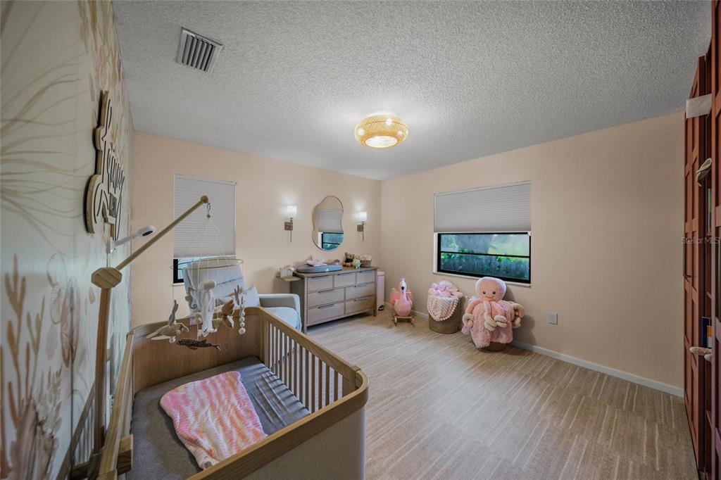 3020 Gypsy Street Sarasota, FL 34231 - Photo 26 of 34 a living room with furniture and wooden floor