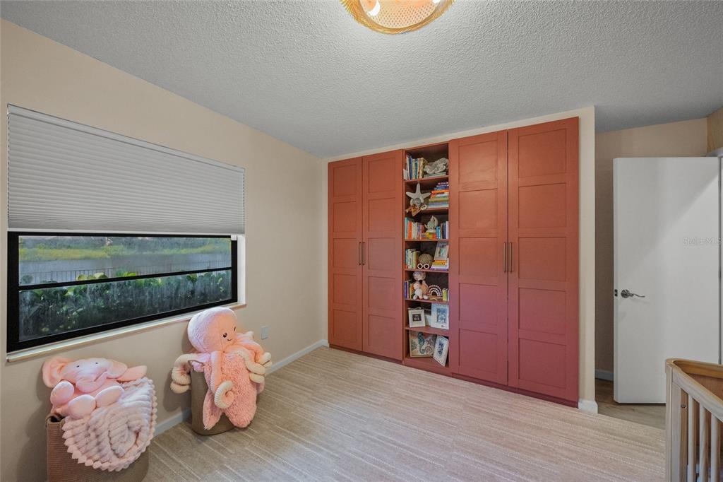 3020 Gypsy Street Sarasota, FL 34231 - Photo 27 of 34 a view of room with window and wooden floor