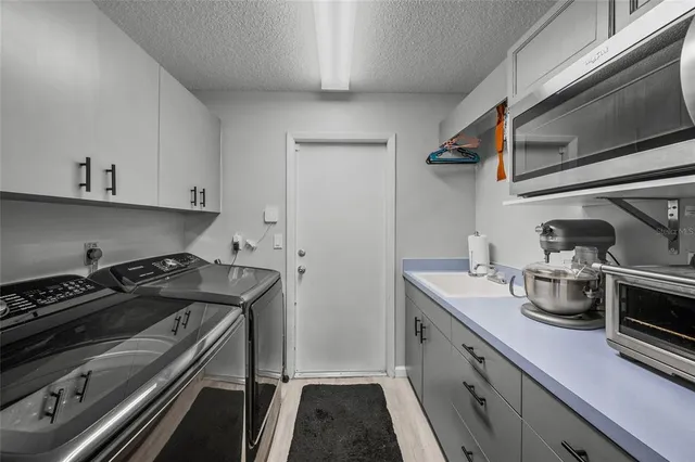 a view of a patio with couches chairs and a yard