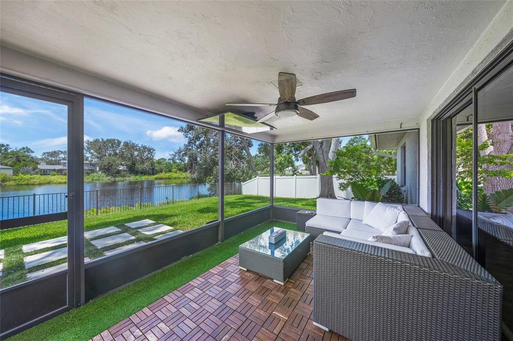 3020 Gypsy Street Sarasota, FL 34231 - Photo 29 of 34 a view of a patio with couches chairs and a yard