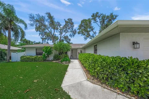 a kitchen with a sink cabinets and window