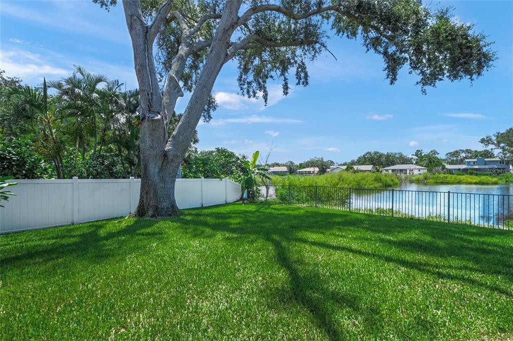 3020 Gypsy Street Sarasota, FL 34231 - Photo 31 of 34 a view of a lake with a yard