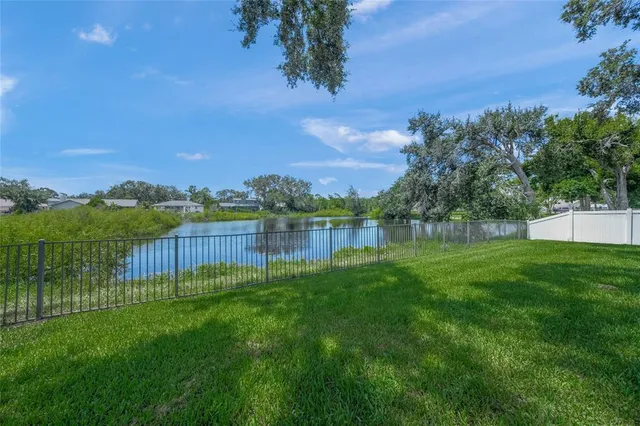 a view of lake with green space