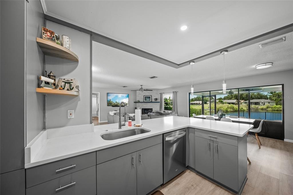 3020 Gypsy Street Sarasota, FL 34231 - Photo 4 of 34 a kitchen with a sink cabinets and window