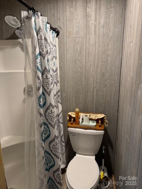 113 Deer Park Road, Unit 9&10D Mount Gilead, NC 27306 - Photo 12 of 17 a bathroom with a toilet and shower curtain