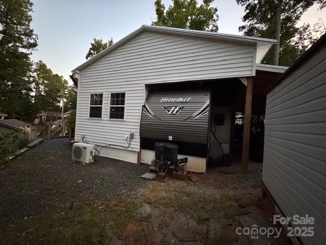 113 Deer Park Road, Unit 9&10D Mount Gilead, NC 27306 - Photo 3 of 17 a view of a small house with a yard and outdoor seating