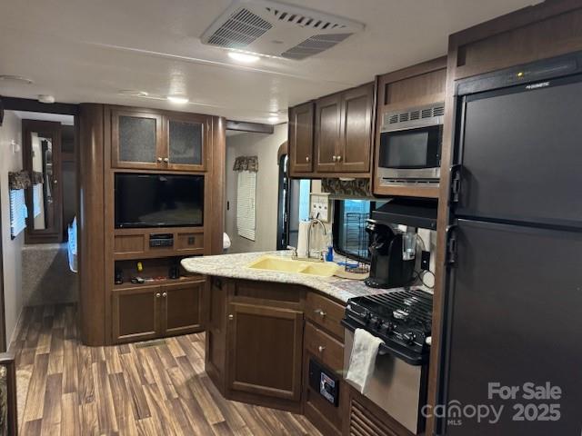 113 Deer Park Road, Unit 9&10D Mount Gilead, NC 27306 - Photo 9 of 17 a kitchen with stainless steel appliances granite countertop a sink stove and refrigerator
