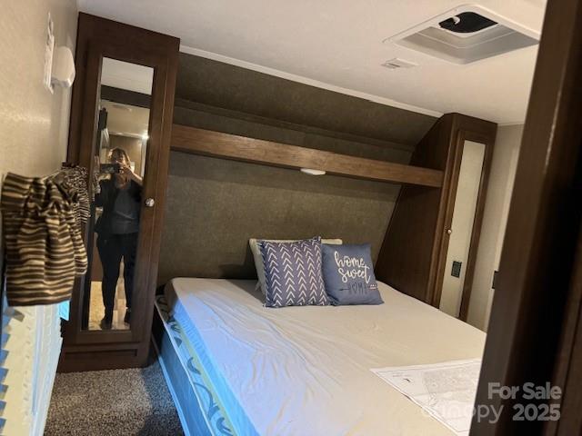 113 Deer Park Road, Unit 9&10D Mount Gilead, NC 27306 - Photo 10 of 17 a bedroom with a bed and a mirror