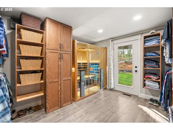 a workspace with wooden floor and a window