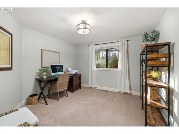 a spacious bathroom with a granite countertop sink mirror and toilet