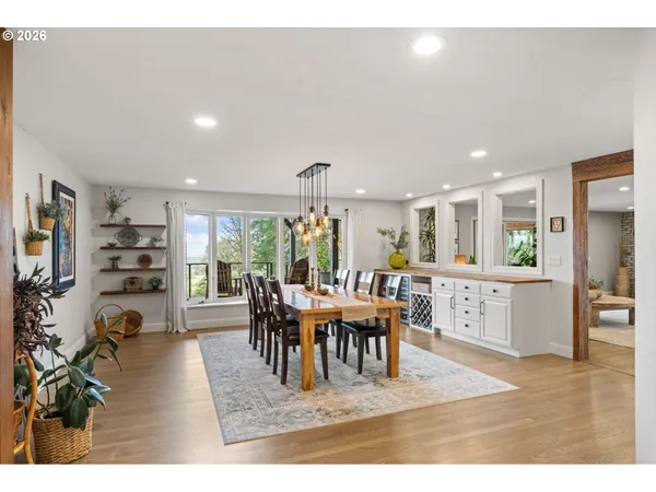 a living room with furniture a window and a dining table