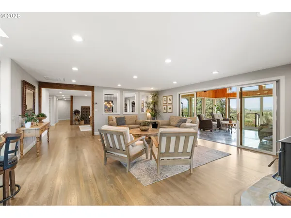 a kitchen with stainless steel appliances granite countertop a stove and white cabinets