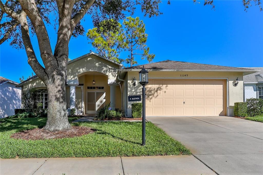 11149 Sun Tree Road Hudson, FL 34667 - Photo 1 of 1 This home has a pleasant curb appeal with mature trees that provide nice shade.