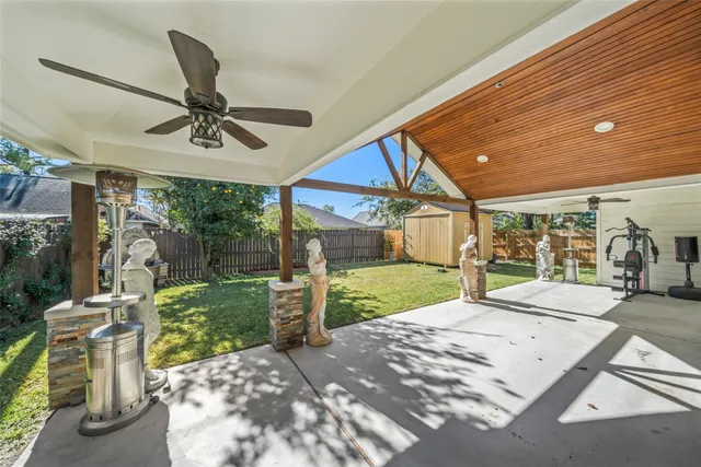 a view of a porch with furniture and garden