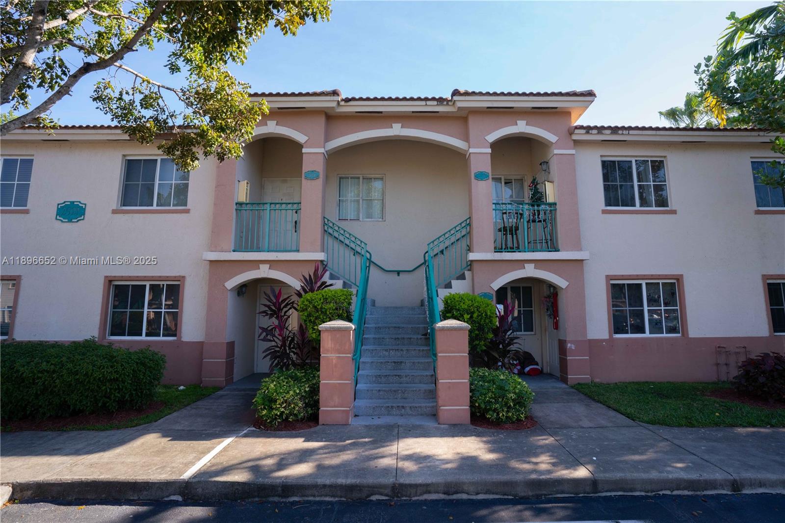 2921 Southeast 13th Road, Unit 20539 Homestead, FL 33035 - Photo 3 of 17 a front view of a house with garden