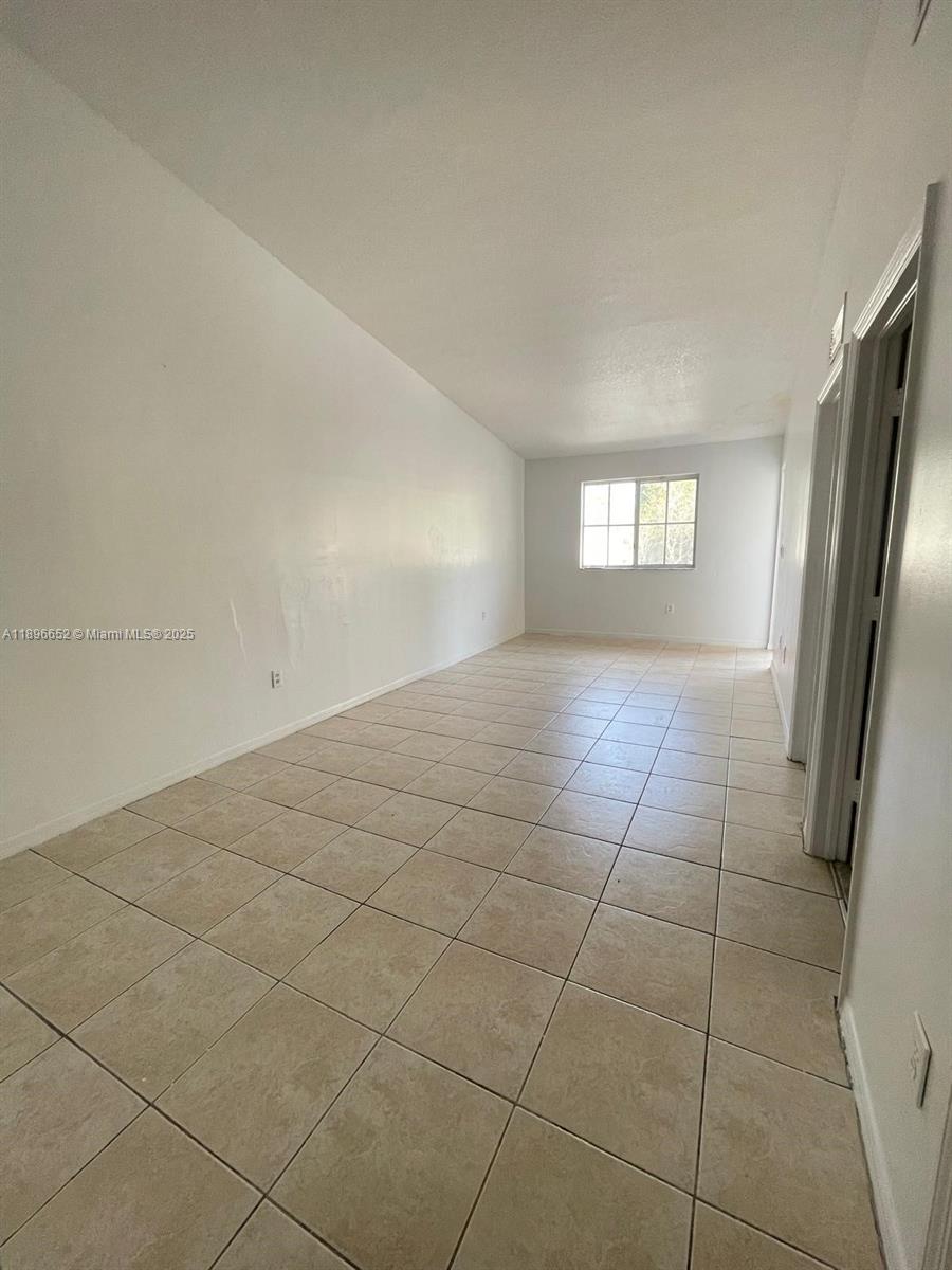 2921 Southeast 13th Road, Unit 20539 Homestead, FL 33035 - Photo 7 of 17 a view of a livingroom and window