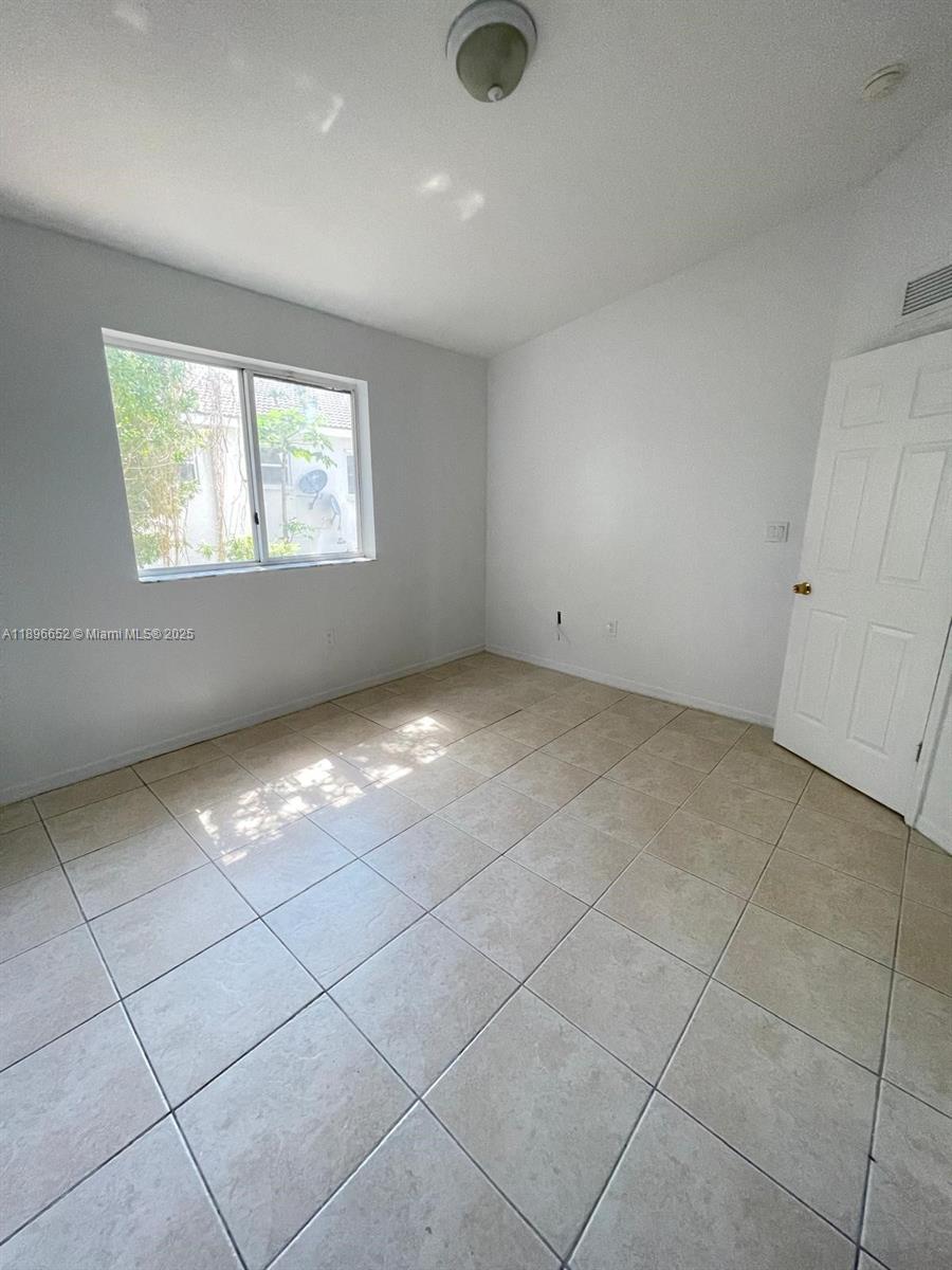 2921 Southeast 13th Road, Unit 20539 Homestead, FL 33035 - Photo 10 of 17 a view of an empty room with a window