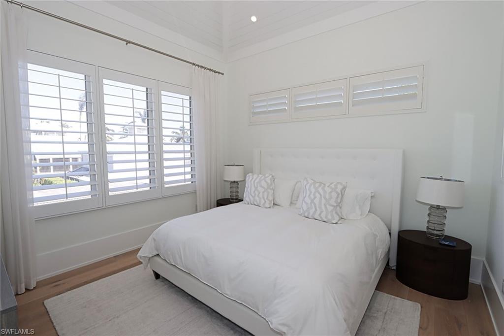 675 2nd Street South Naples, FL 34102 - Photo 15 of 31 a bedroom with a bed and a window