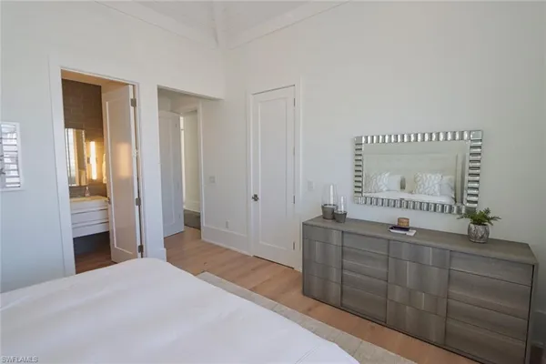 a bedroom with a bed and a dresser