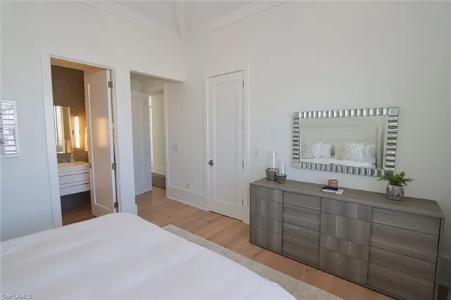 a bedroom with a bed and a dresser