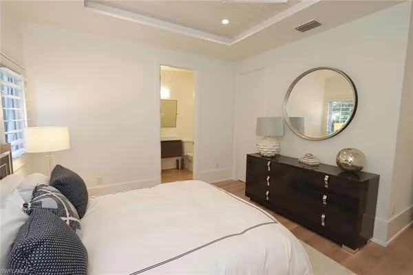 a bedroom with a bed and a dresser