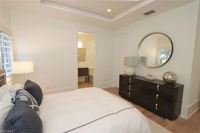 a bedroom with a bed and a dresser