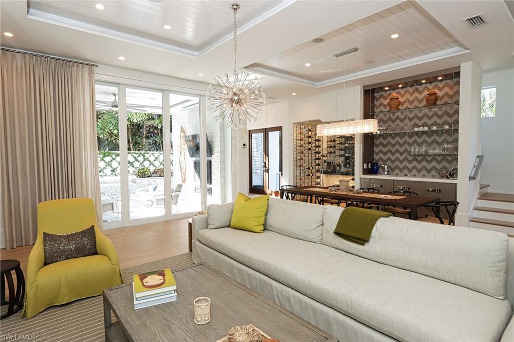 675 2nd Street South Naples, FL 34102 - Photo 2 of 31 a living room with furniture and a large window