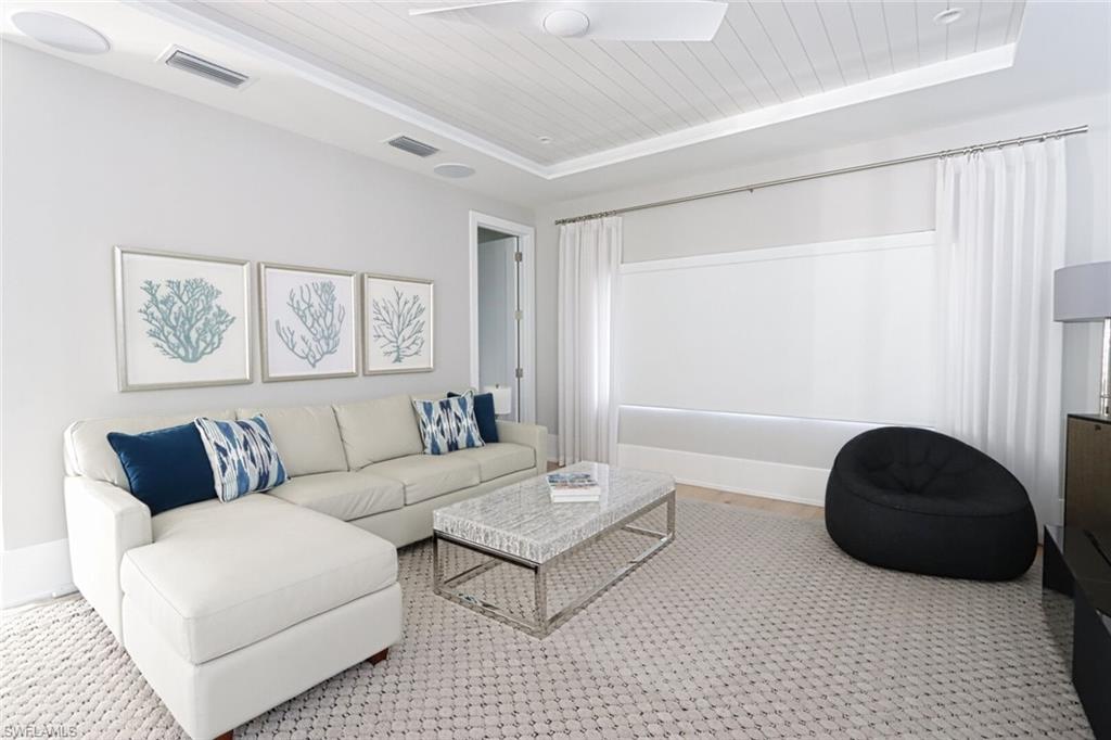 675 2nd Street South Naples, FL 34102 - Photo 21 of 31 a living room with furniture and a large window