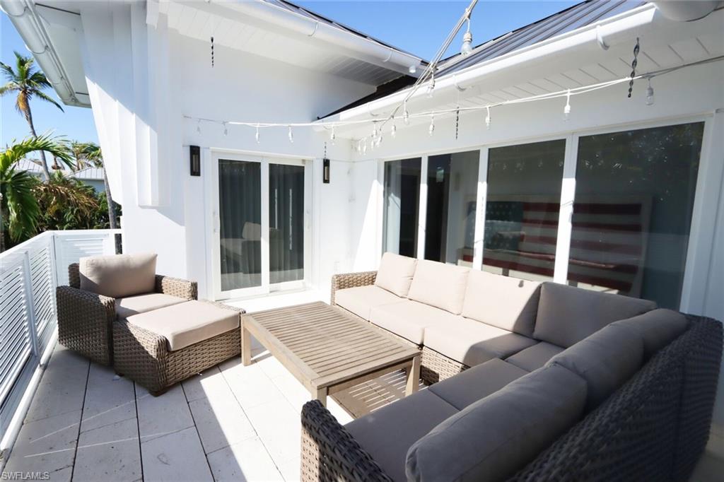 675 2nd Street South Naples, FL 34102 - Photo 24 of 31 a outdoor space with patio couch and a potted plant