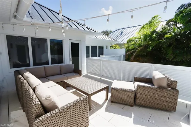 a outdoor living space with furniture and a potted plant