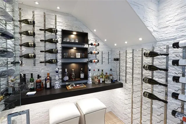 a kitchen with refrigerator and cabinets