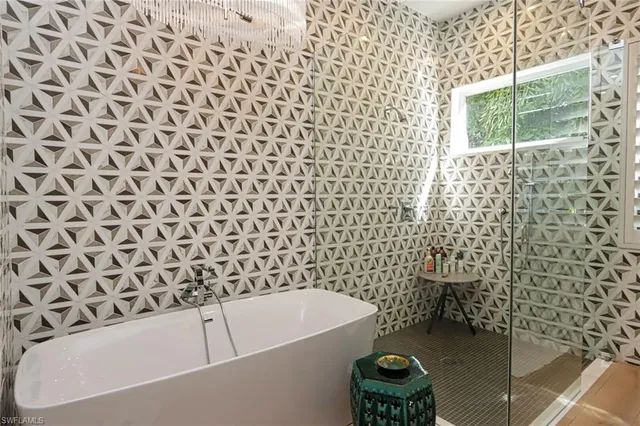 a bathroom with a bathtub and a shower
