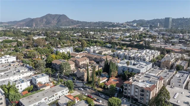 an aerial view of multiple houses with outdoor space