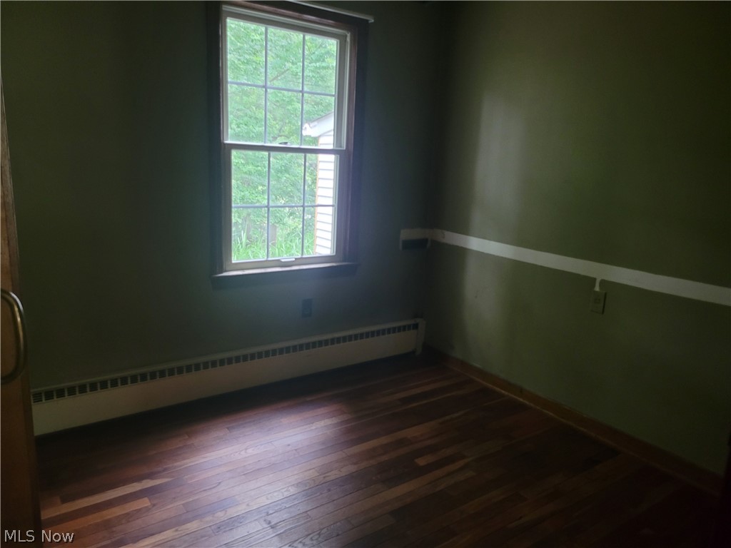 7357 Westview Road Kent, OH 44240 - Photo 19 of 30 Unfurnished room with a baseboard radiator and dark hardwood / wood-style flooring
