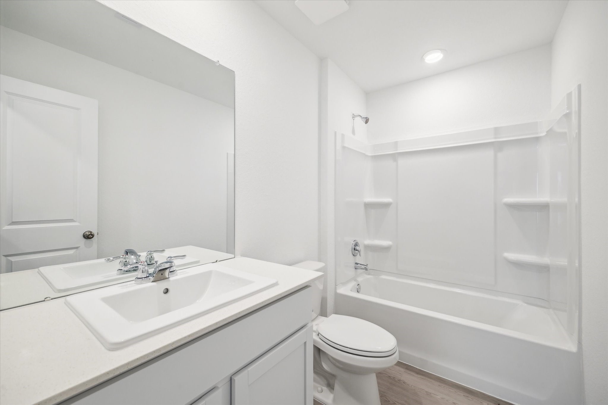 18015 Trepito Avenue New Caney, TX 77357 - Photo 11 of 14 a bathroom with a sink toilet vanity and shower