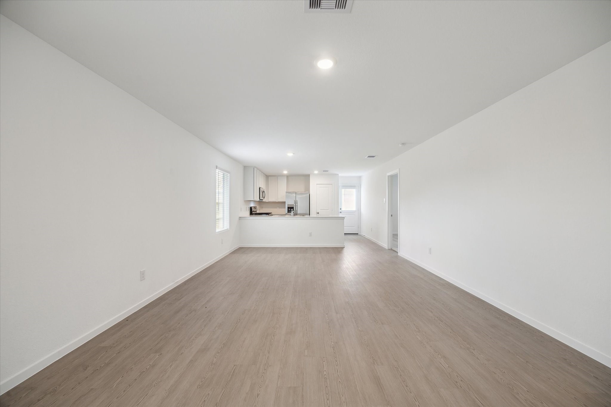 18015 Trepito Avenue New Caney, TX 77357 - Photo 4 of 14 a view of a electric room and wooden floor