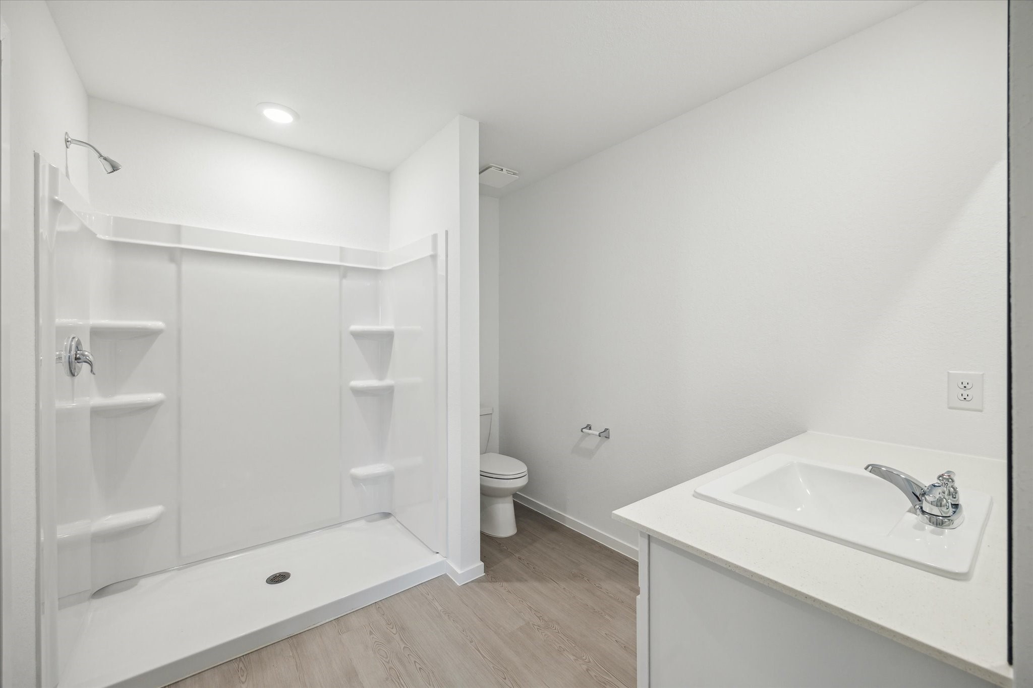 18015 Trepito Avenue New Caney, TX 77357 - Photo 8 of 14 a bathroom with a granite countertop sink a toilet and shower