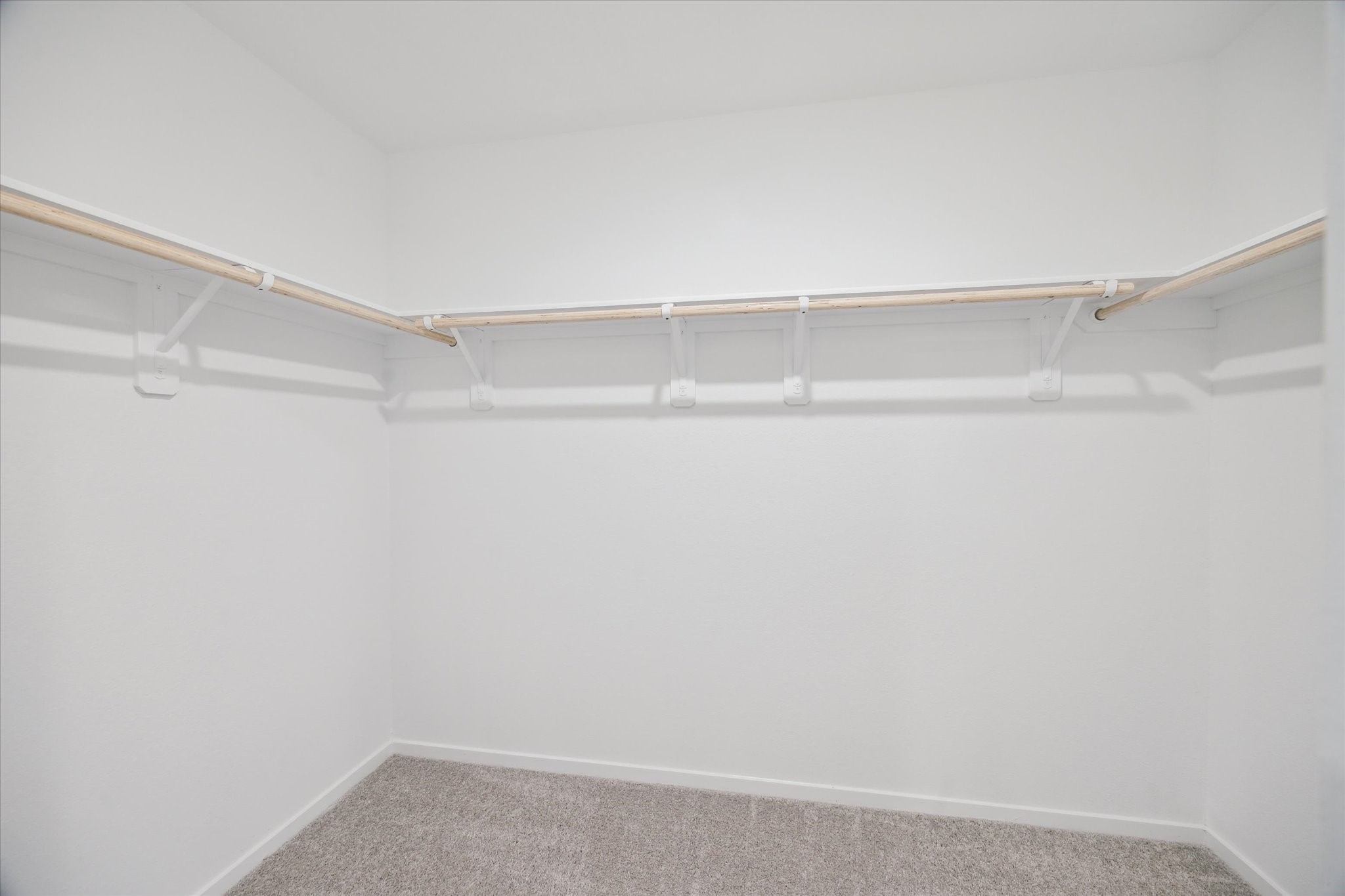 18015 Trepito Avenue New Caney, TX 77357 - Photo 9 of 14 a view of an empty walk in closet